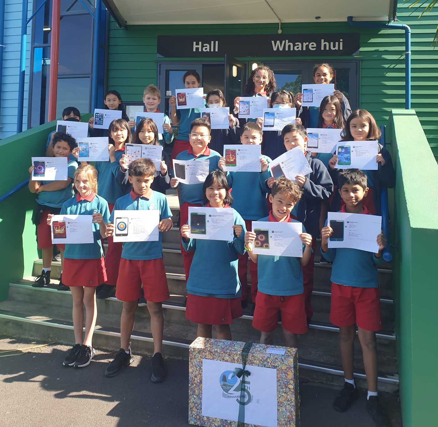 Pinehill students holding up printed apps